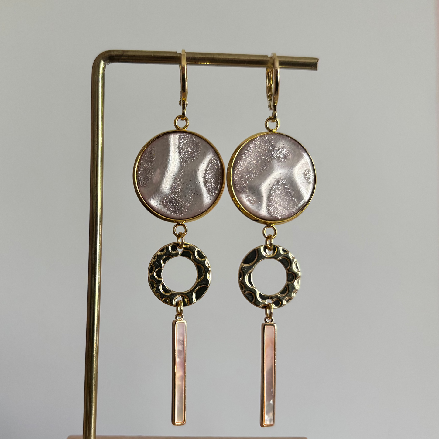 roze disc, gouden cirkel, shell staafje
