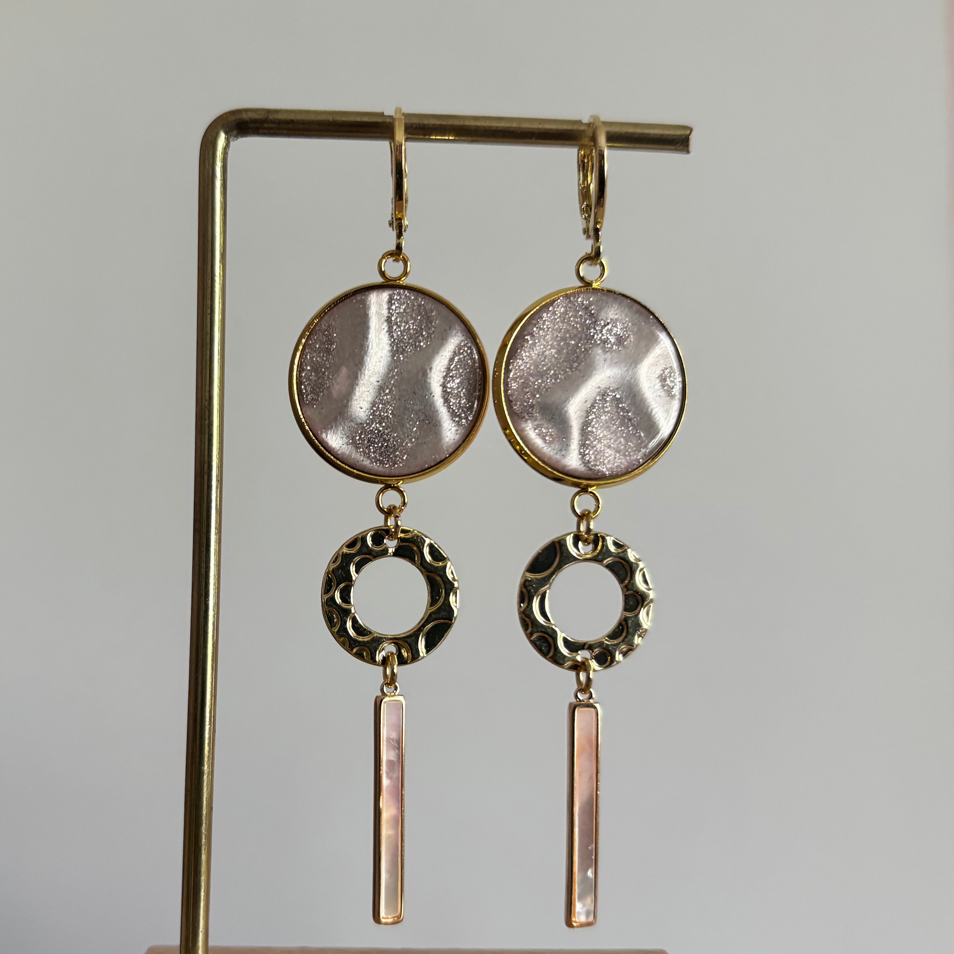 roze disc, gouden cirkel, shell staafje
